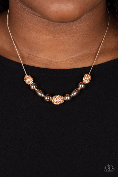 Space Glam - Paparazzi - Rose Gold Rhinestone Encrusted Necklace